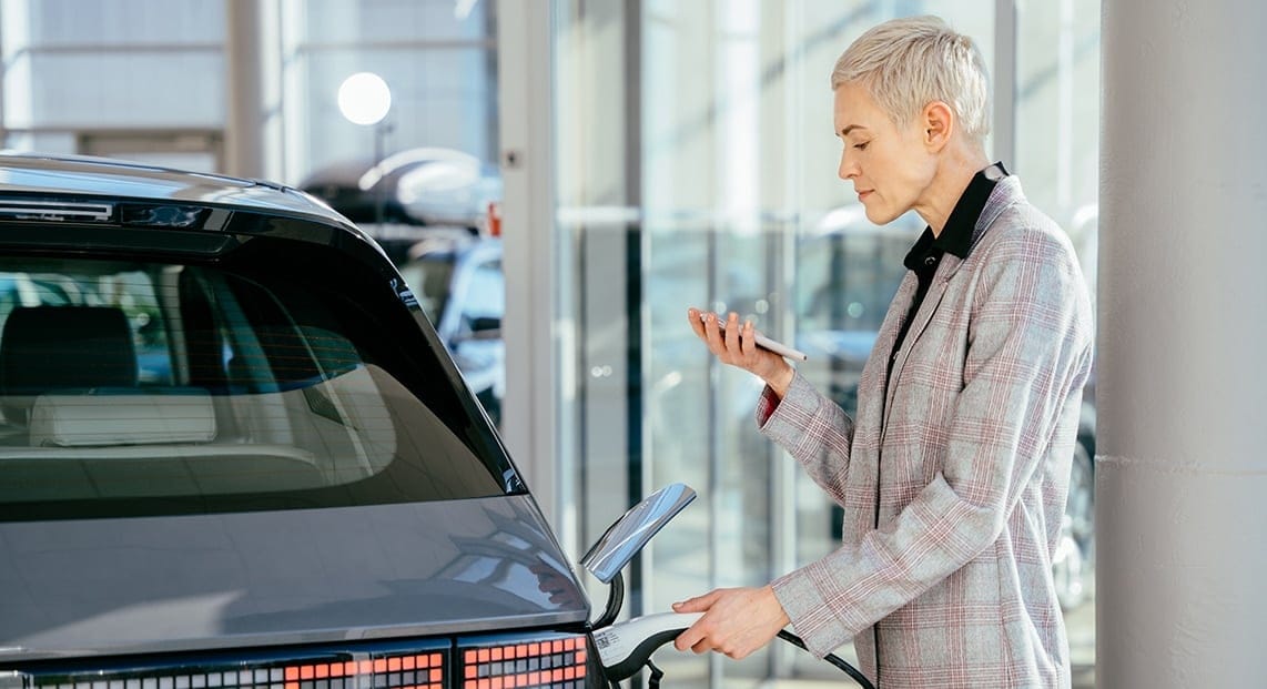 a woman charging a car