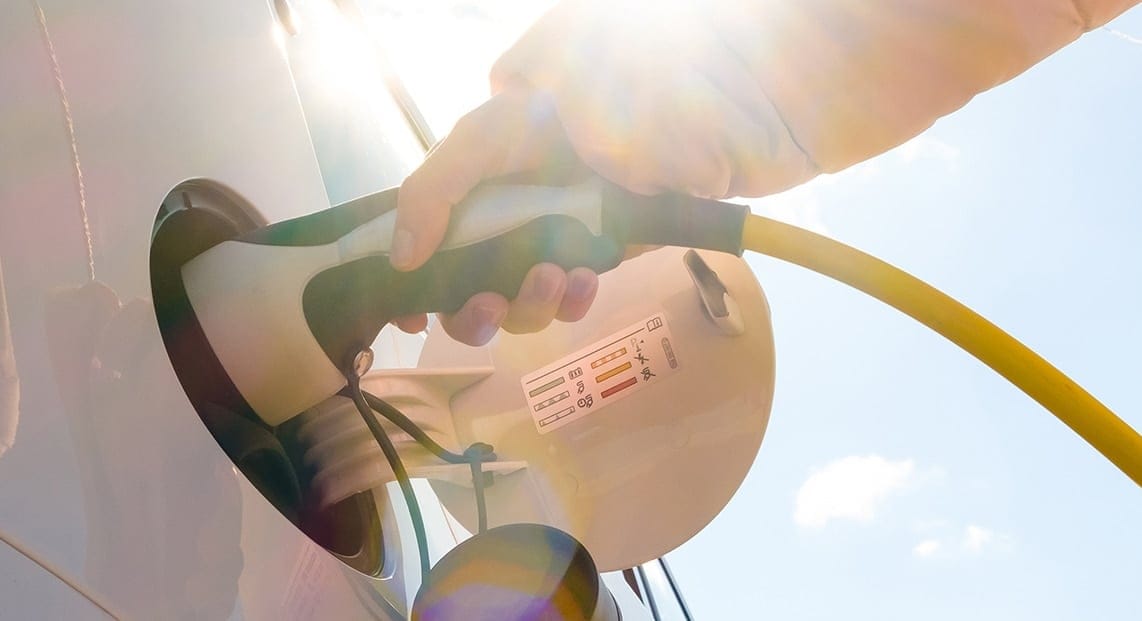 a person holding a gas pump