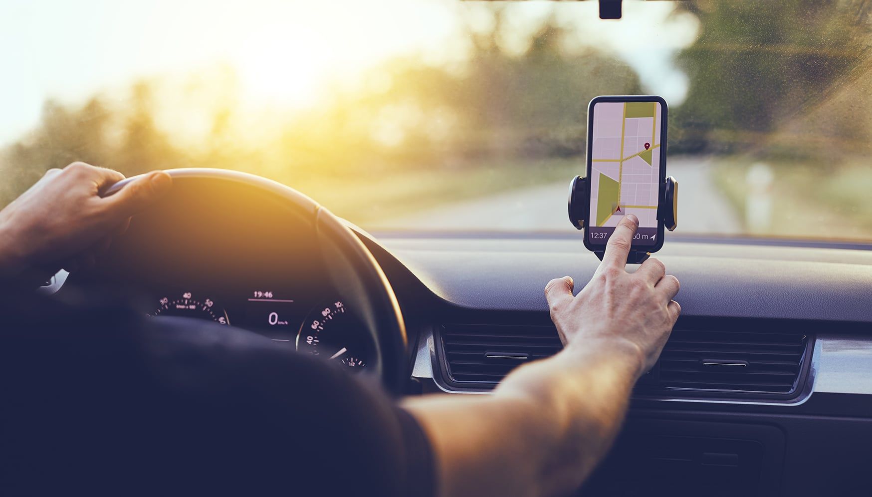 a person using a phone in a car