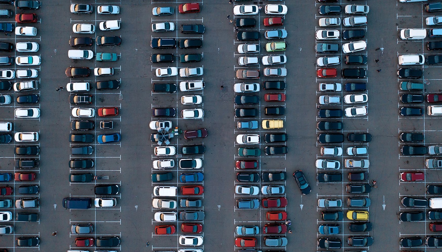 A large parking lot full of vehicles