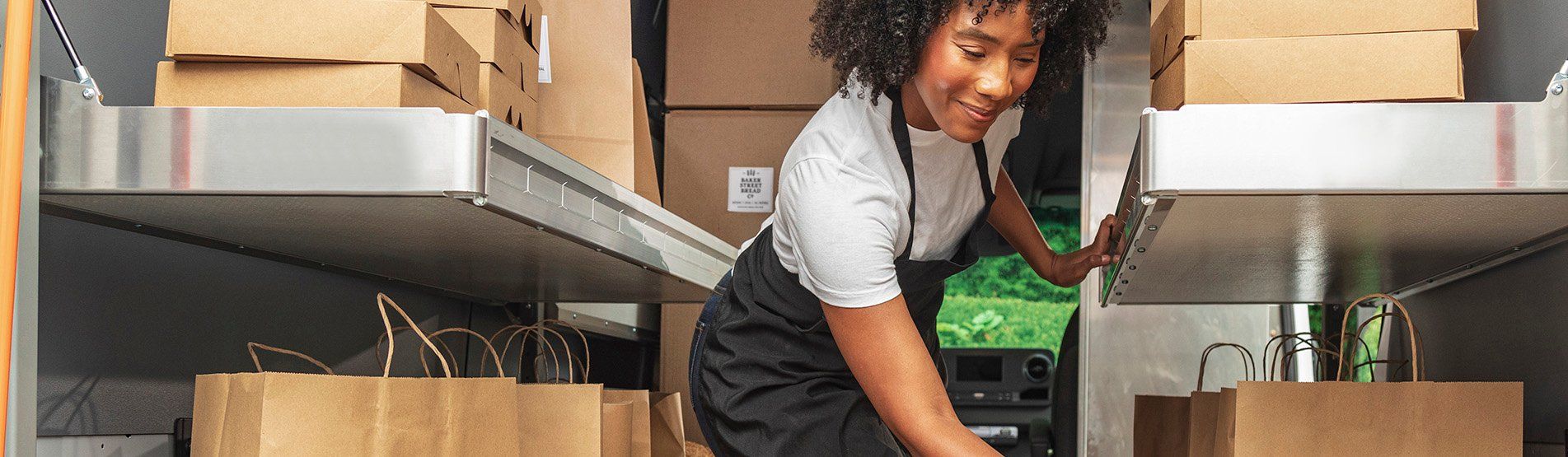 a woman in a black apron