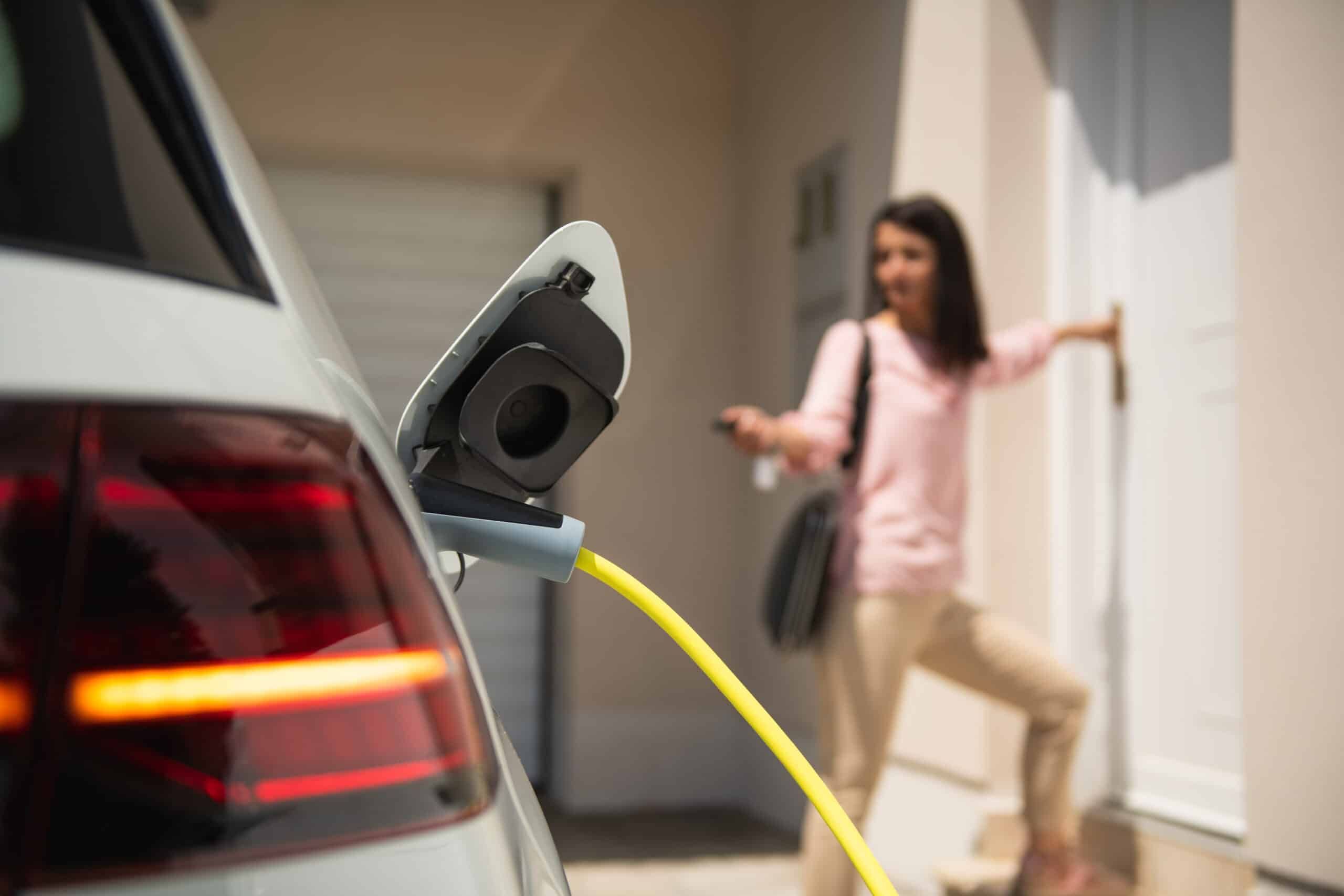 Woman charging her vehicle