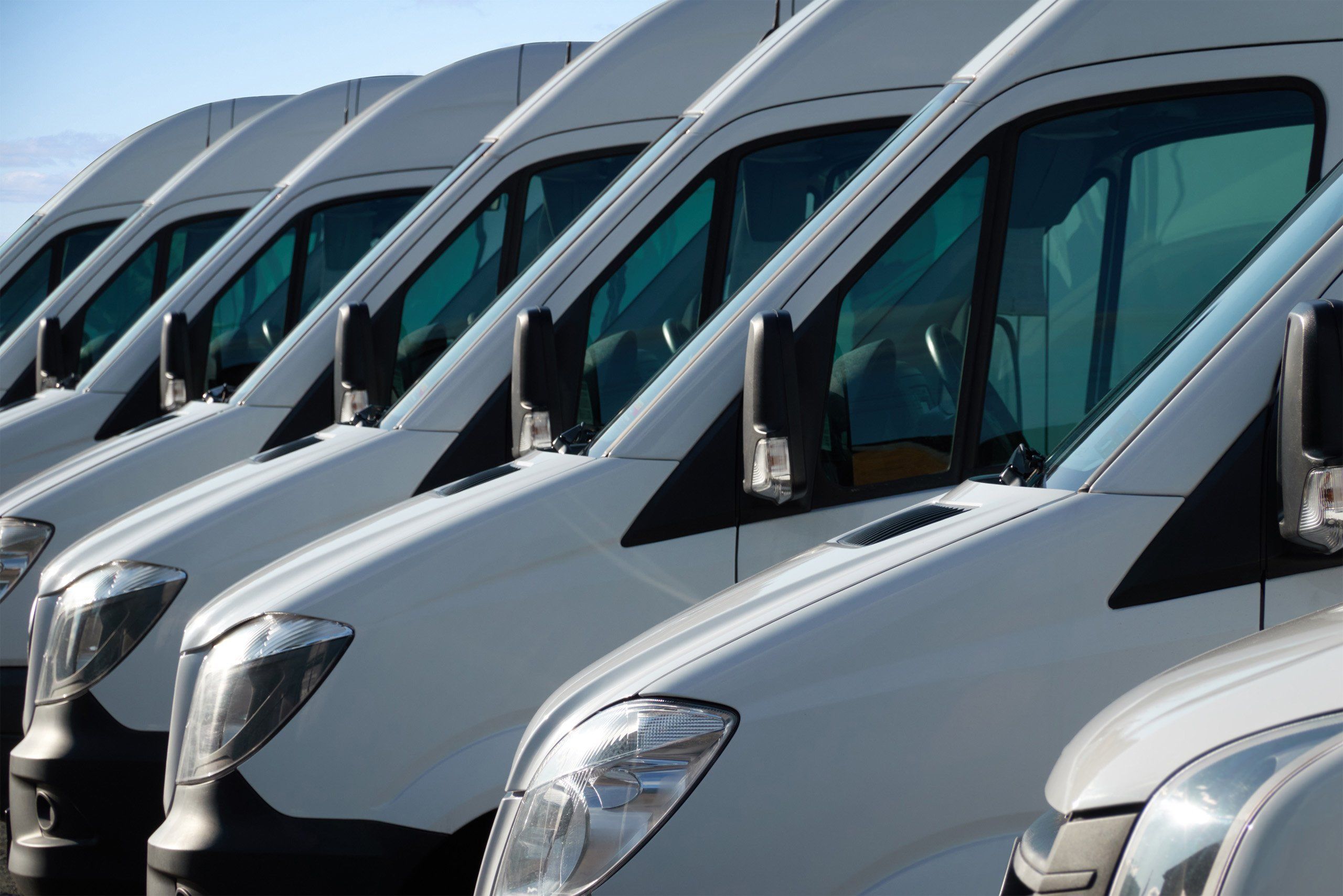 a row of white vans