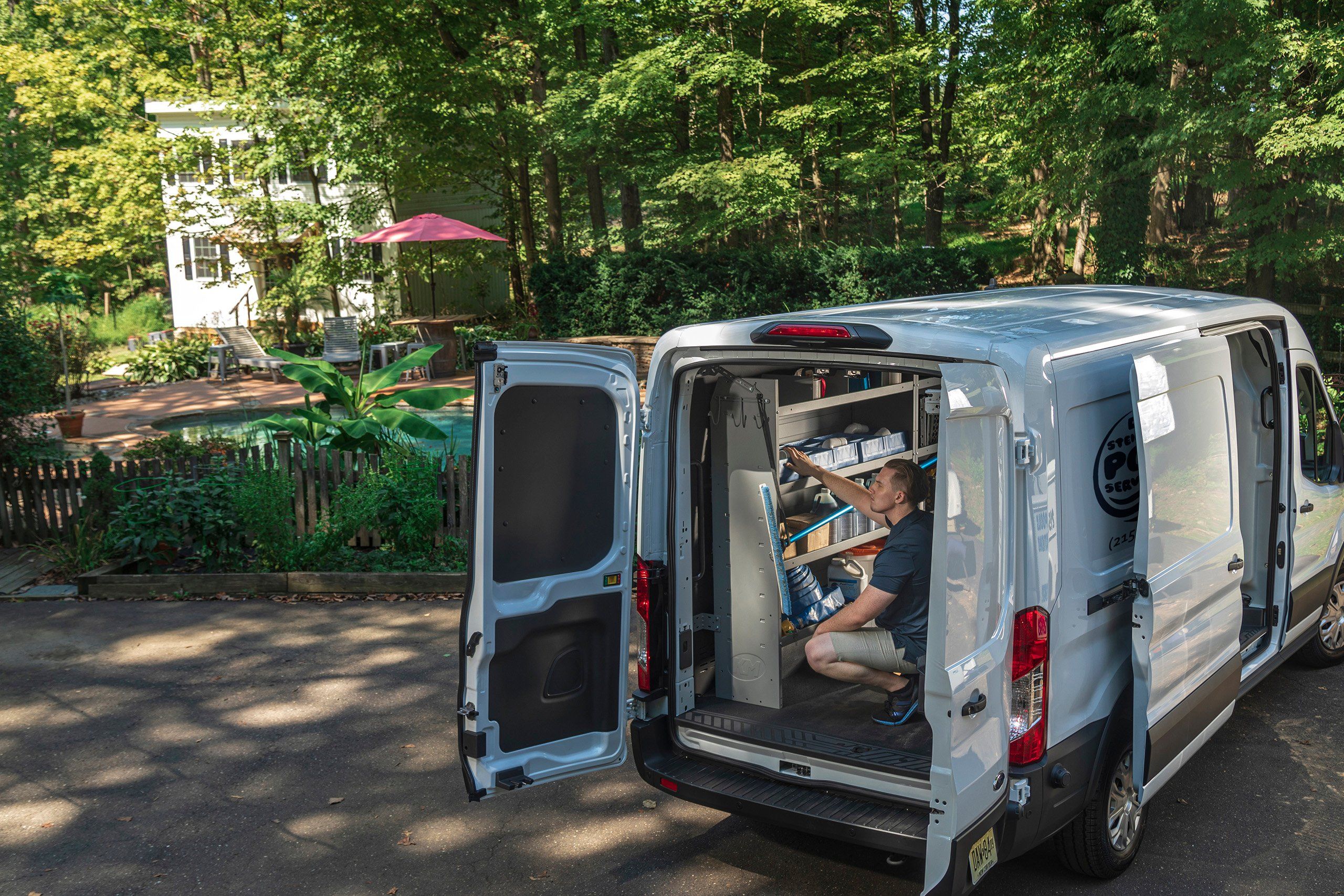 a man sitting in the back of a van