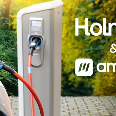 holman invests in electric vehicle management software innovator ampup