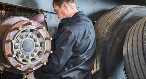 a man fixing a wheel