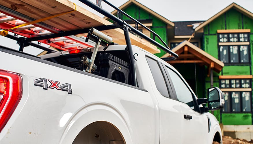 A white pickup truck with racks on top