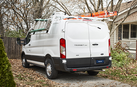 A white Transit van with ladders