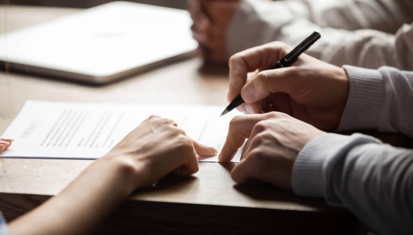 a person signing a document