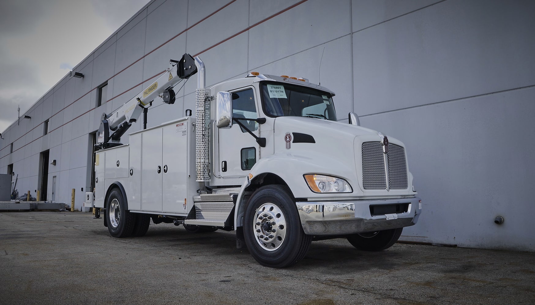 a white truck with a crane