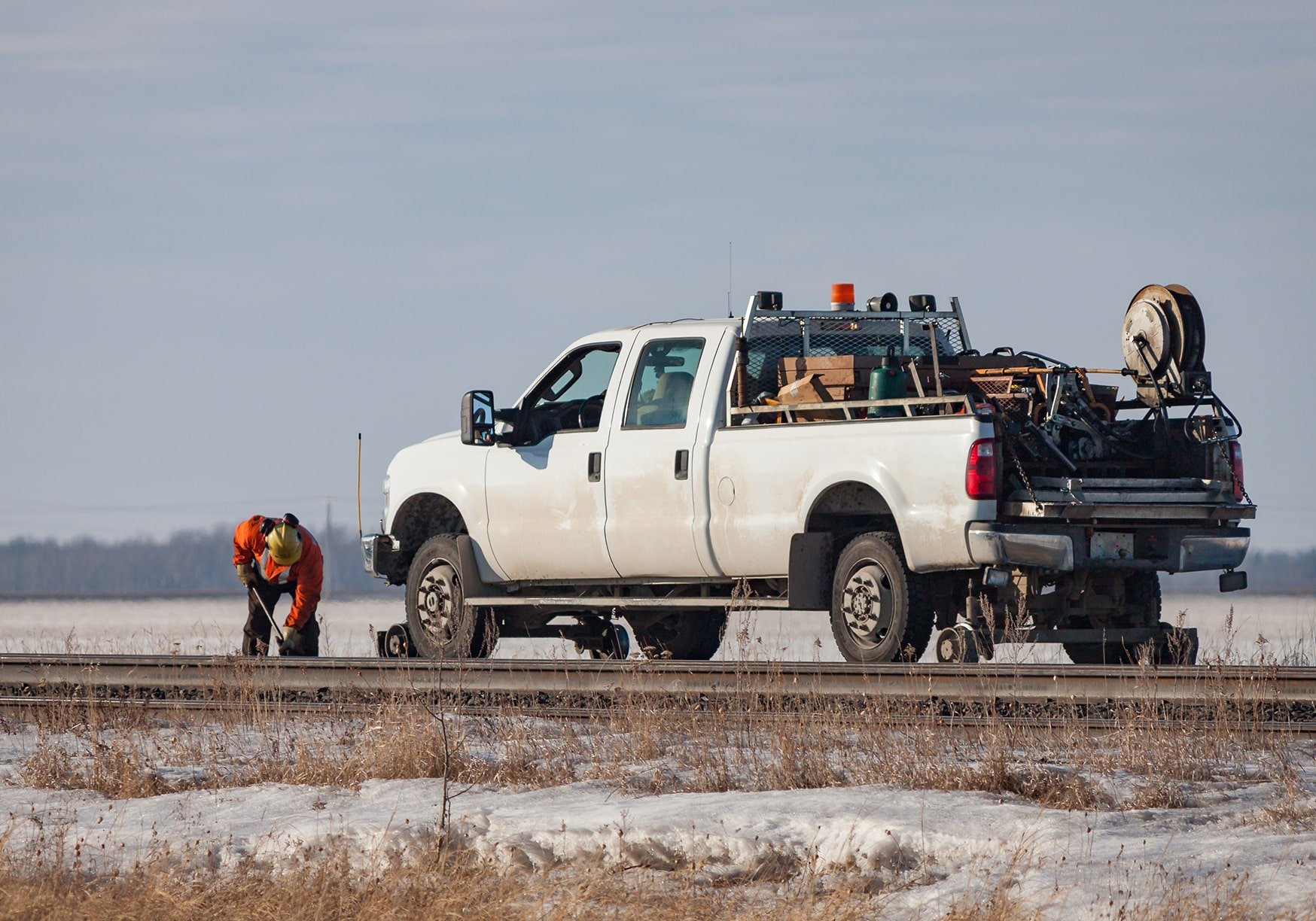 An upfitting truck specialized for railroads on a track