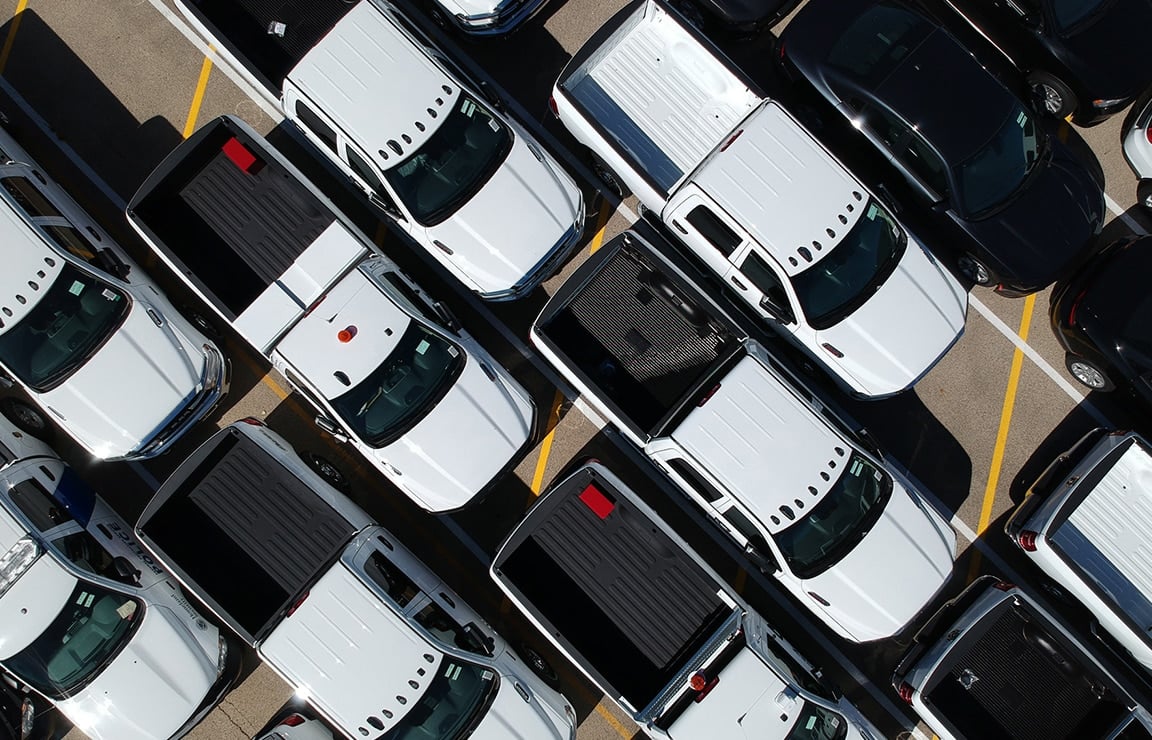 a group of cars parked in a parking lot