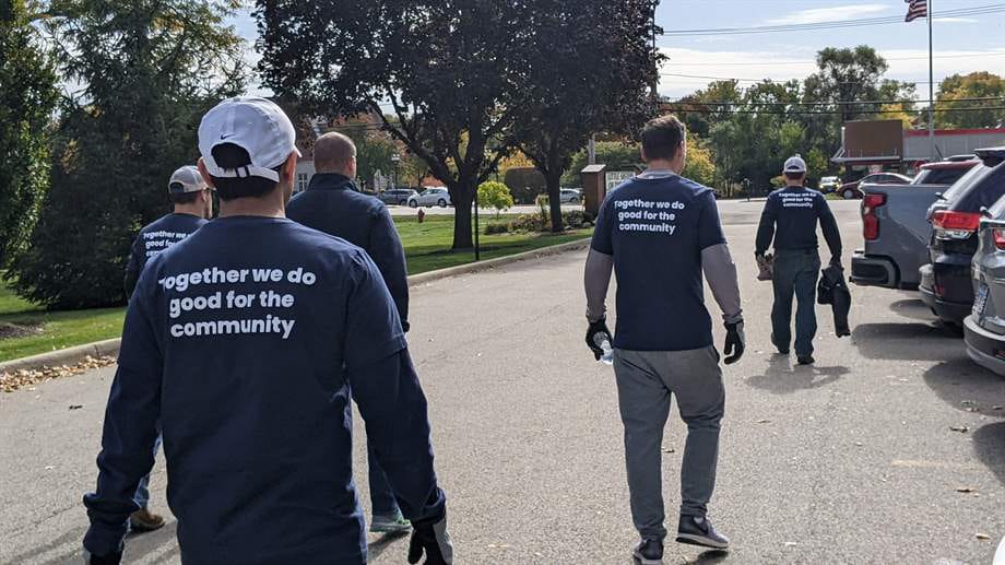 a group of men walking on a street
