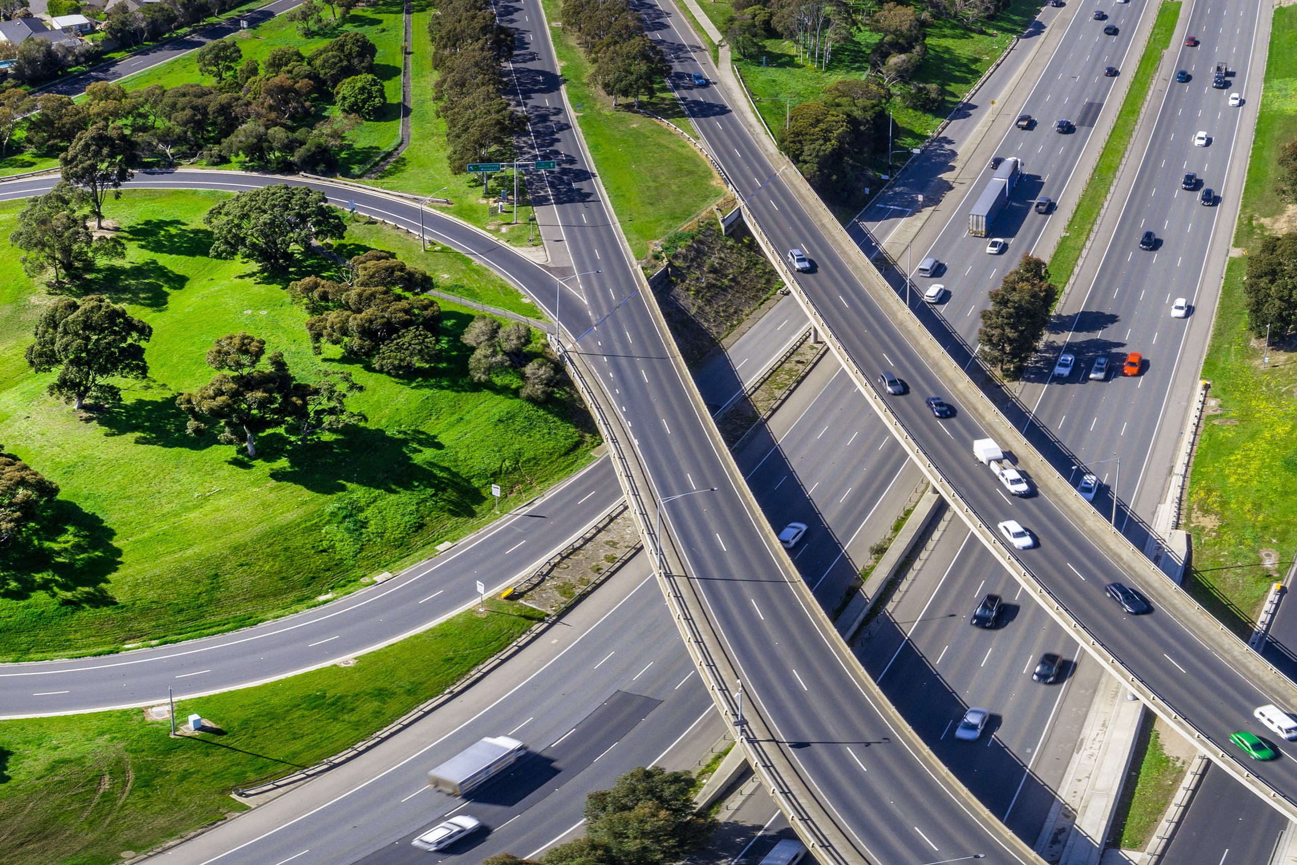 a highway with many roads and trees