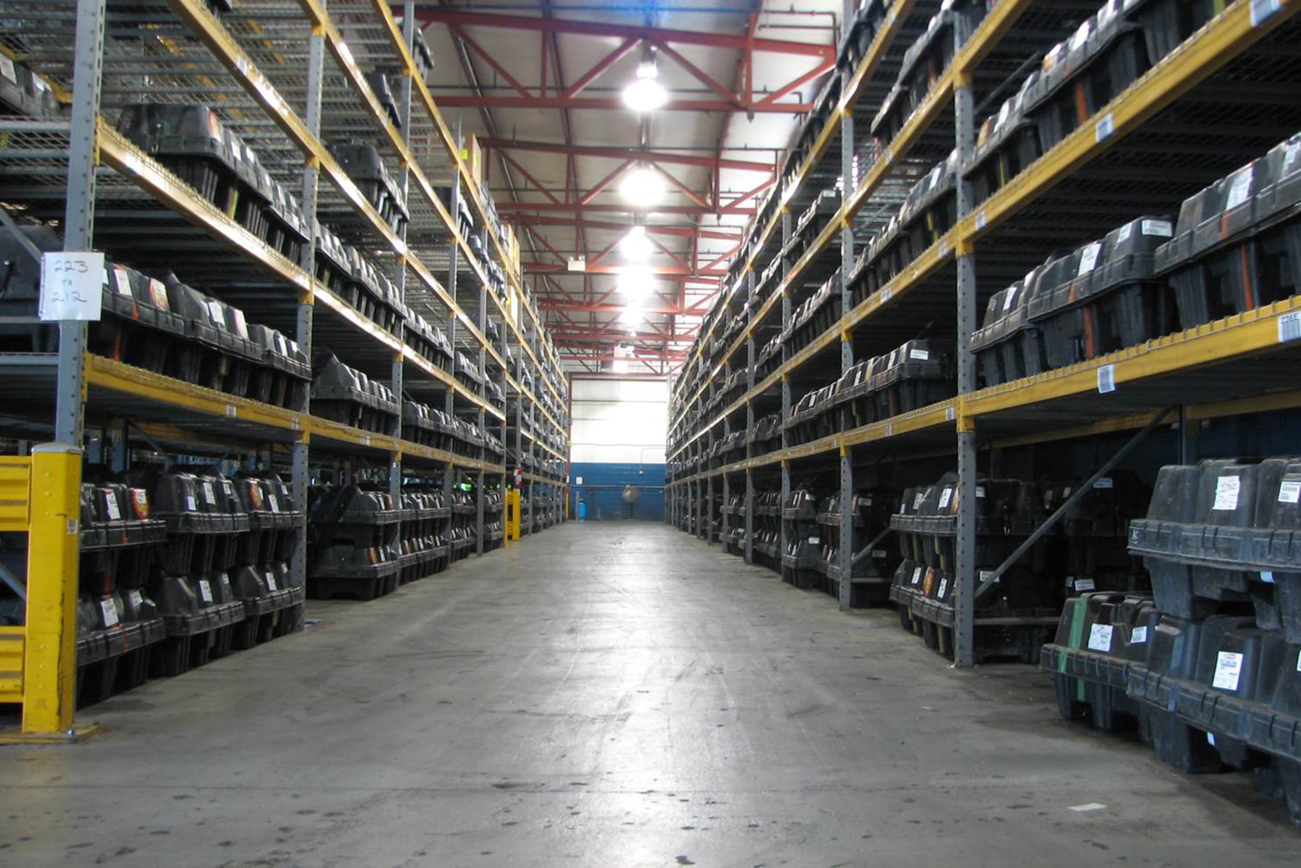 a warehouse with shelves and a large ceiling