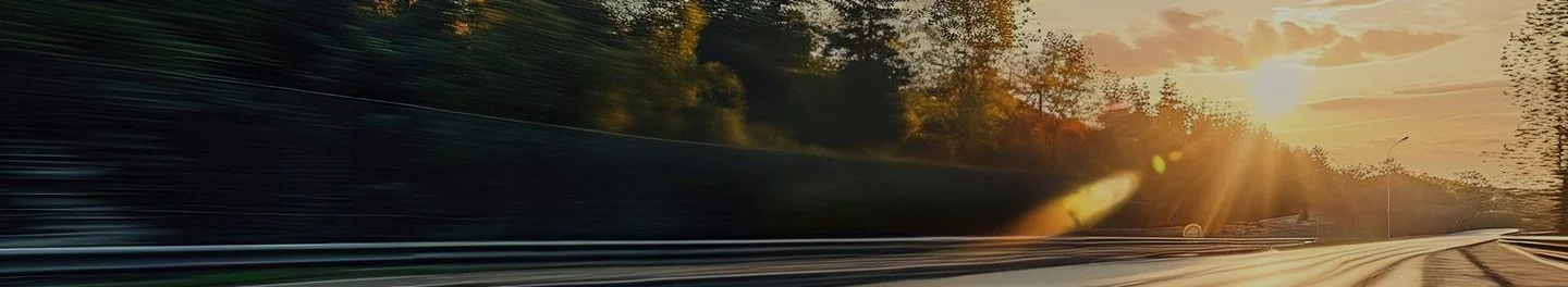 a blurry image of a car driving on a road